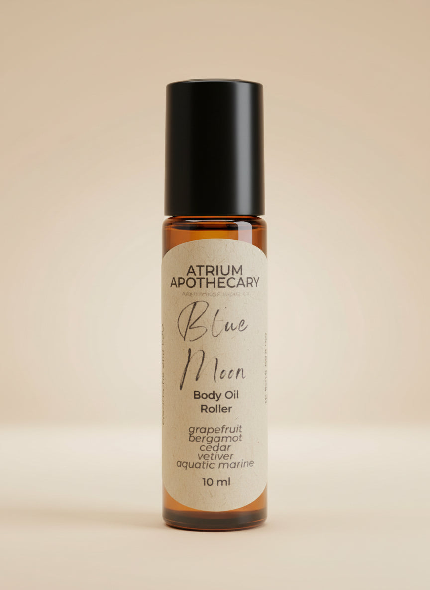 Atrium Apothecary Blue Moon Body Oil Roller on a wooden surface
