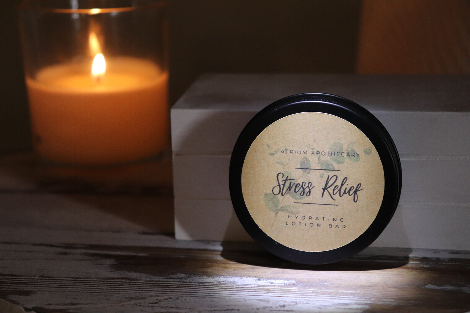 Solid stress relief lotion bar on a clean surface, handcrafted moisturizing bar with herbal mint and citrus fragrance.
